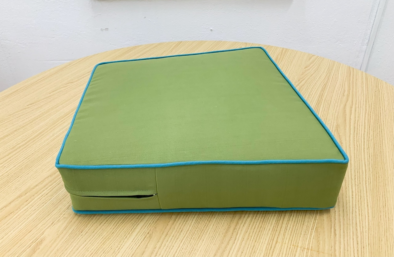 Green Trapezoid Cushion Cover with Surfy Blue Piping