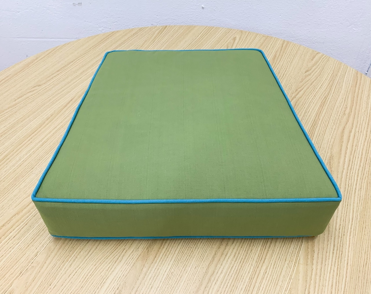 Green Trapezoid Cushion Cover with Surfy Blue Piping
